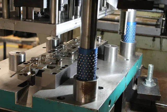 Progressive die in a stamping press